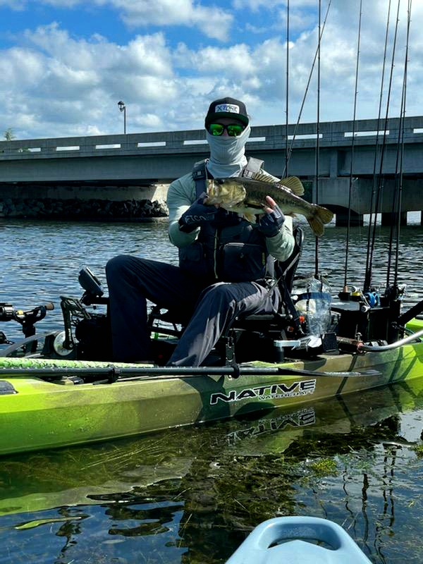 Picture of kayak fisherman holding bass