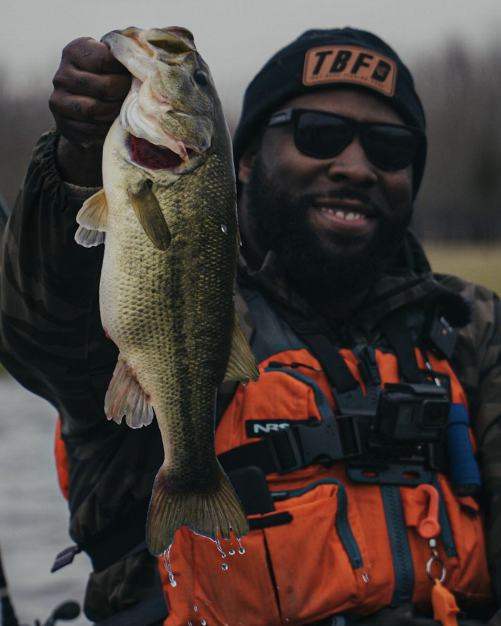 TBFD Holding up a Bass he caught from his kayak