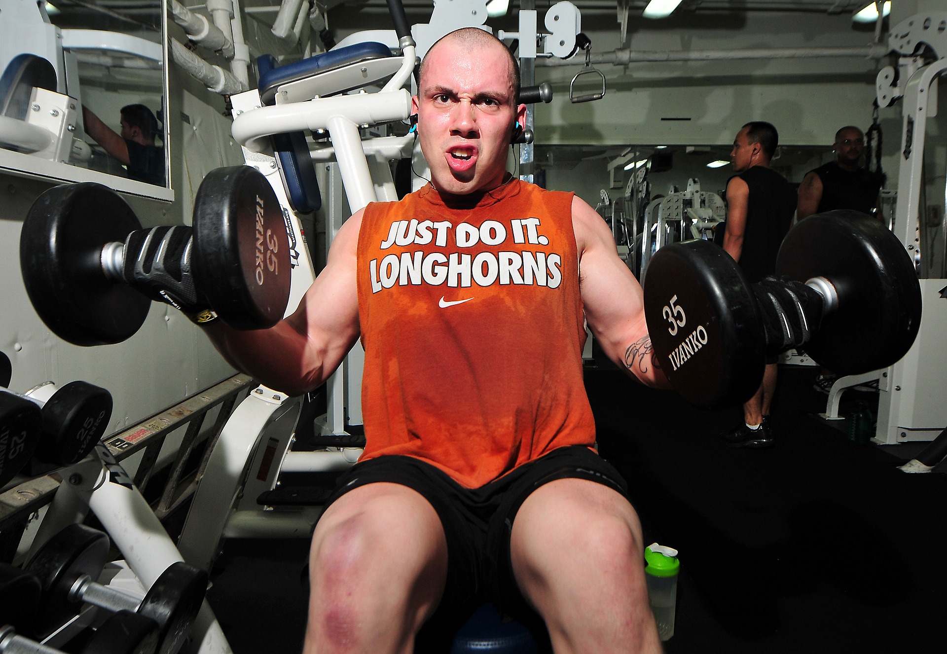 man working out with dumbells